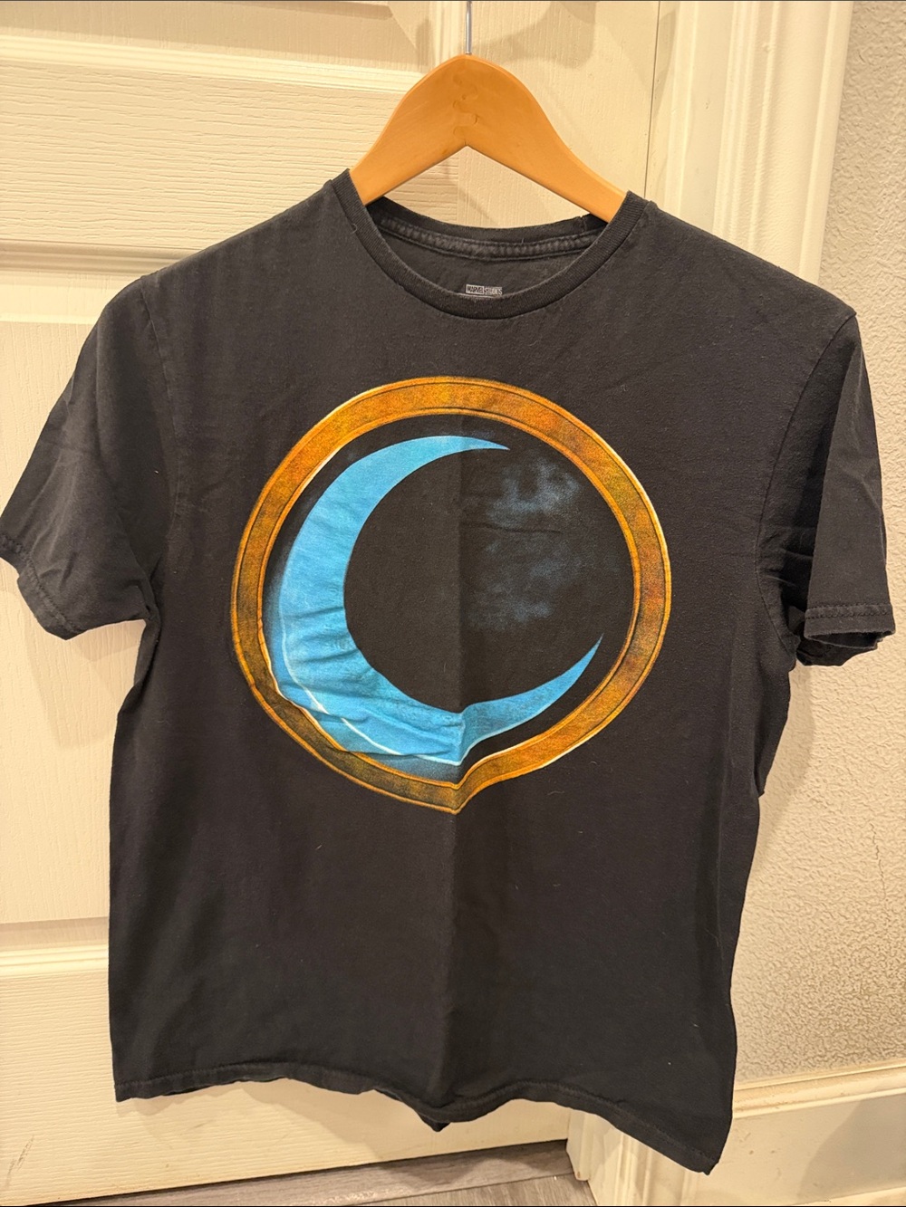 Marvel Black Short-Sleeve Tee with Blue Crescent and Gold Ring